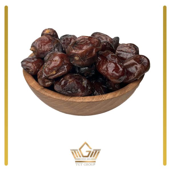 kalote dates in a brown wooden bowl